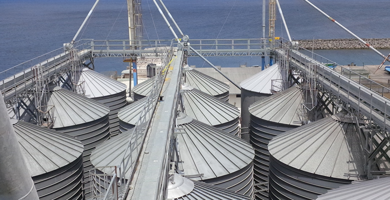 Welders working on a ship hull section