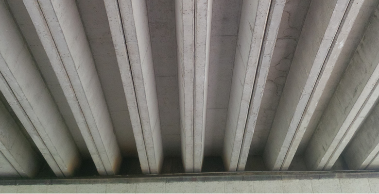 Pre-stressed concrete roof structure